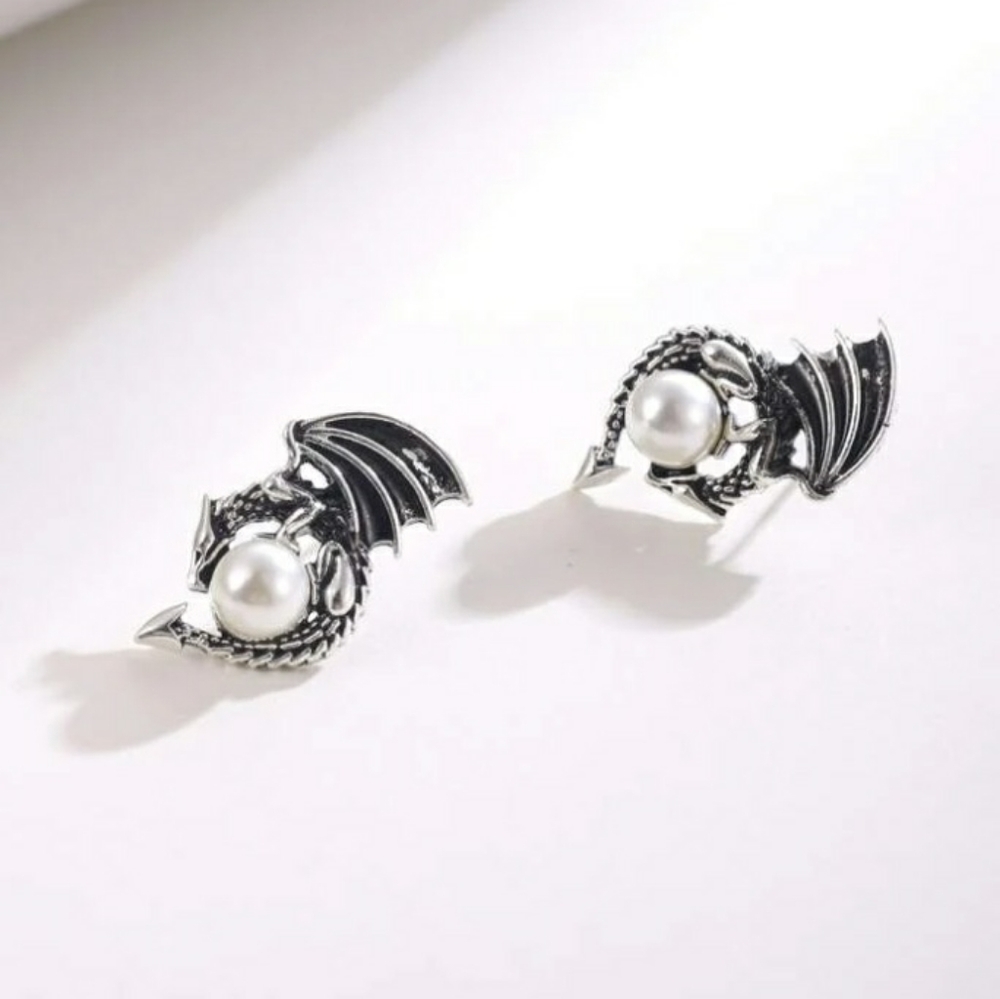 Dragon holding pearl earrings